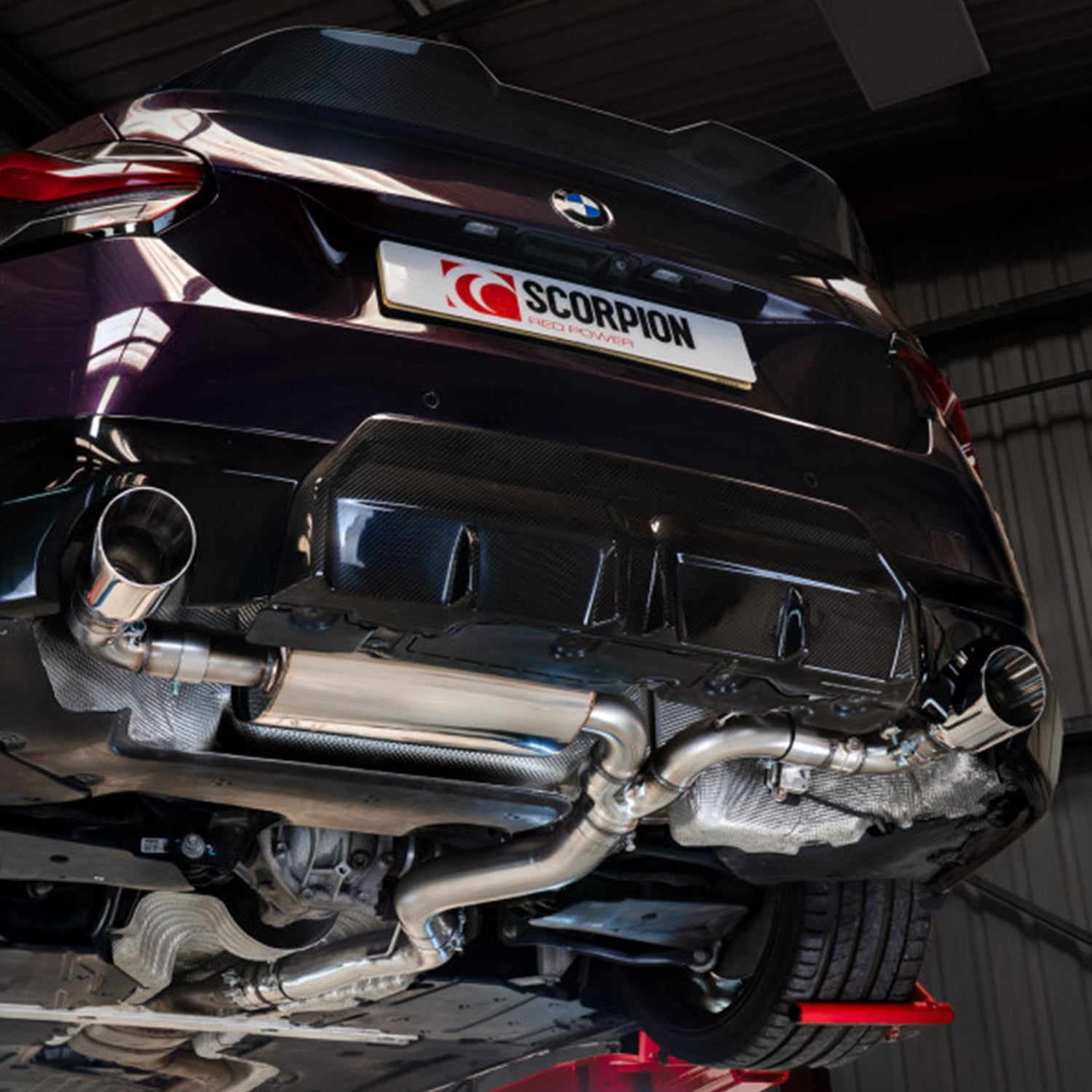 BMW G42 230i Coupe with a Scorpion exhaust system in a garage setting