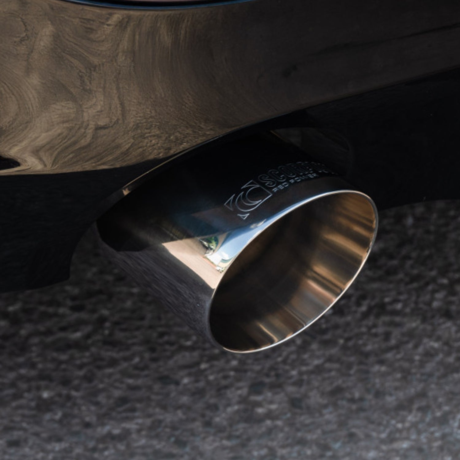Close-up of BMW G42 230i Scorpion chrome exhaust tip