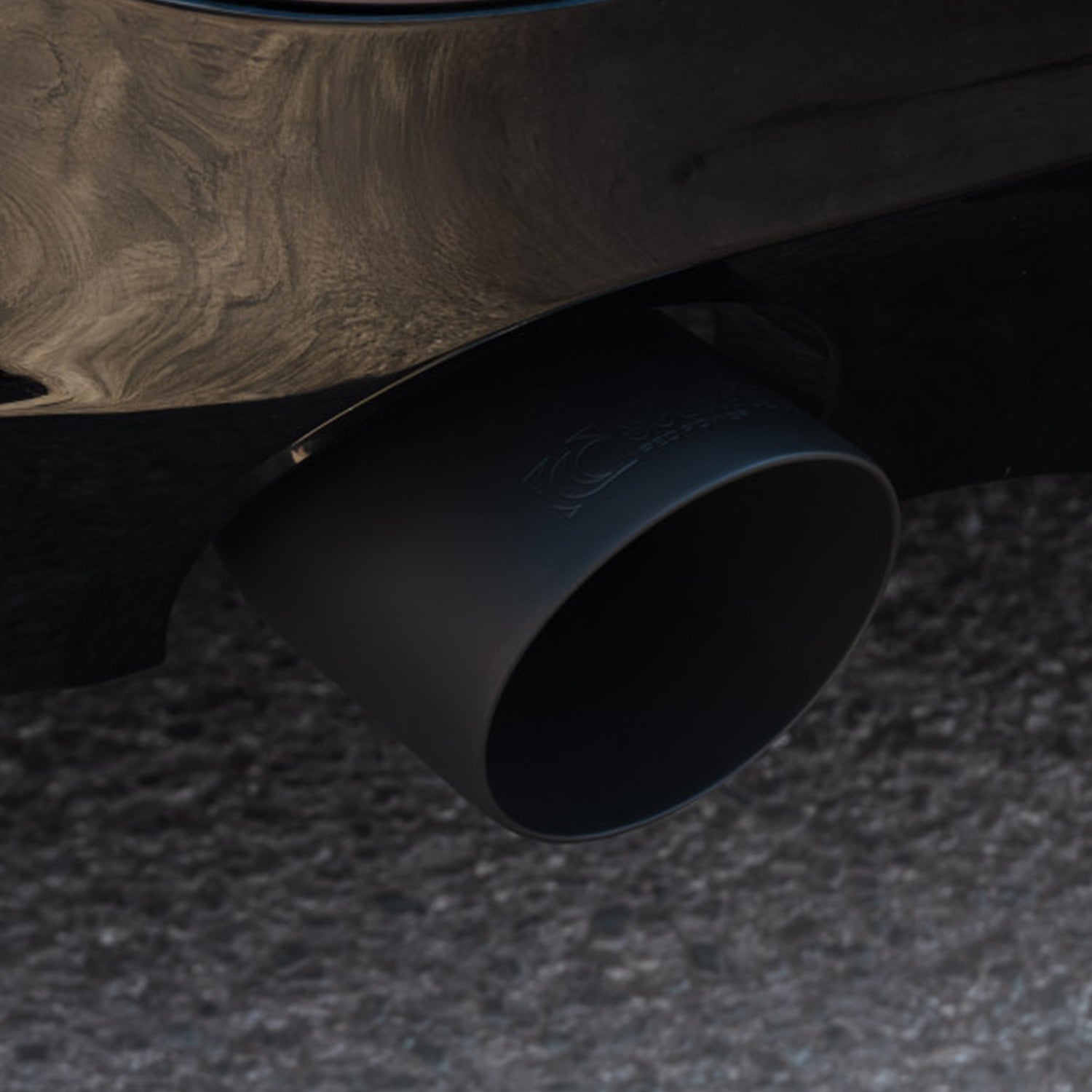 Close-up of BMW G42 230i Scorpion matte black exhaust tip