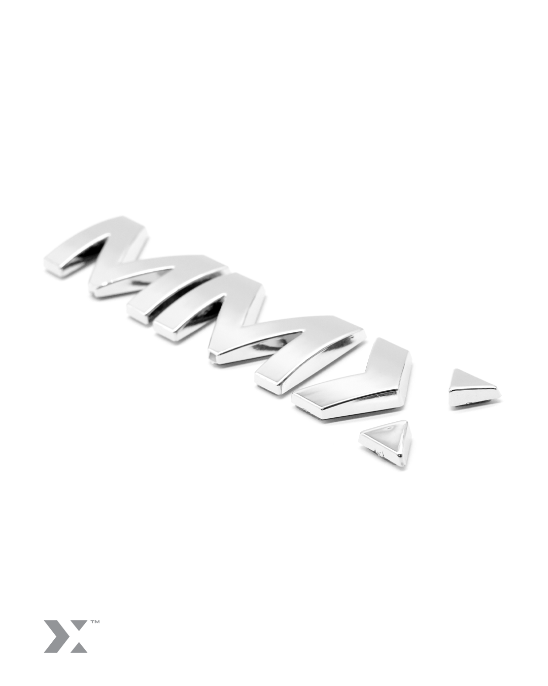 MMX 100mm vehicle badge in bright chrome finish with 3M adhesive backing
