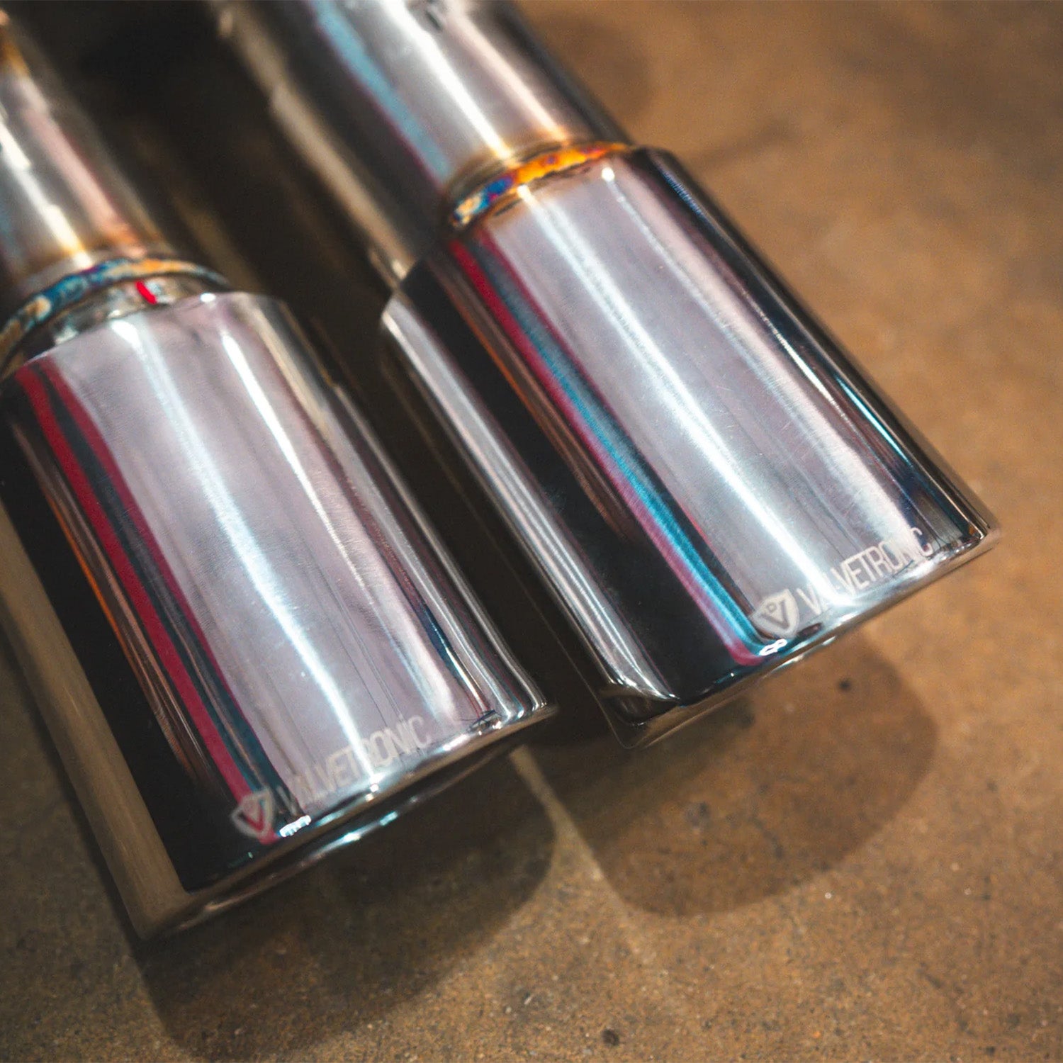 BMW E60 M5 Valvetronic Designs exhaust system on a concrete floor