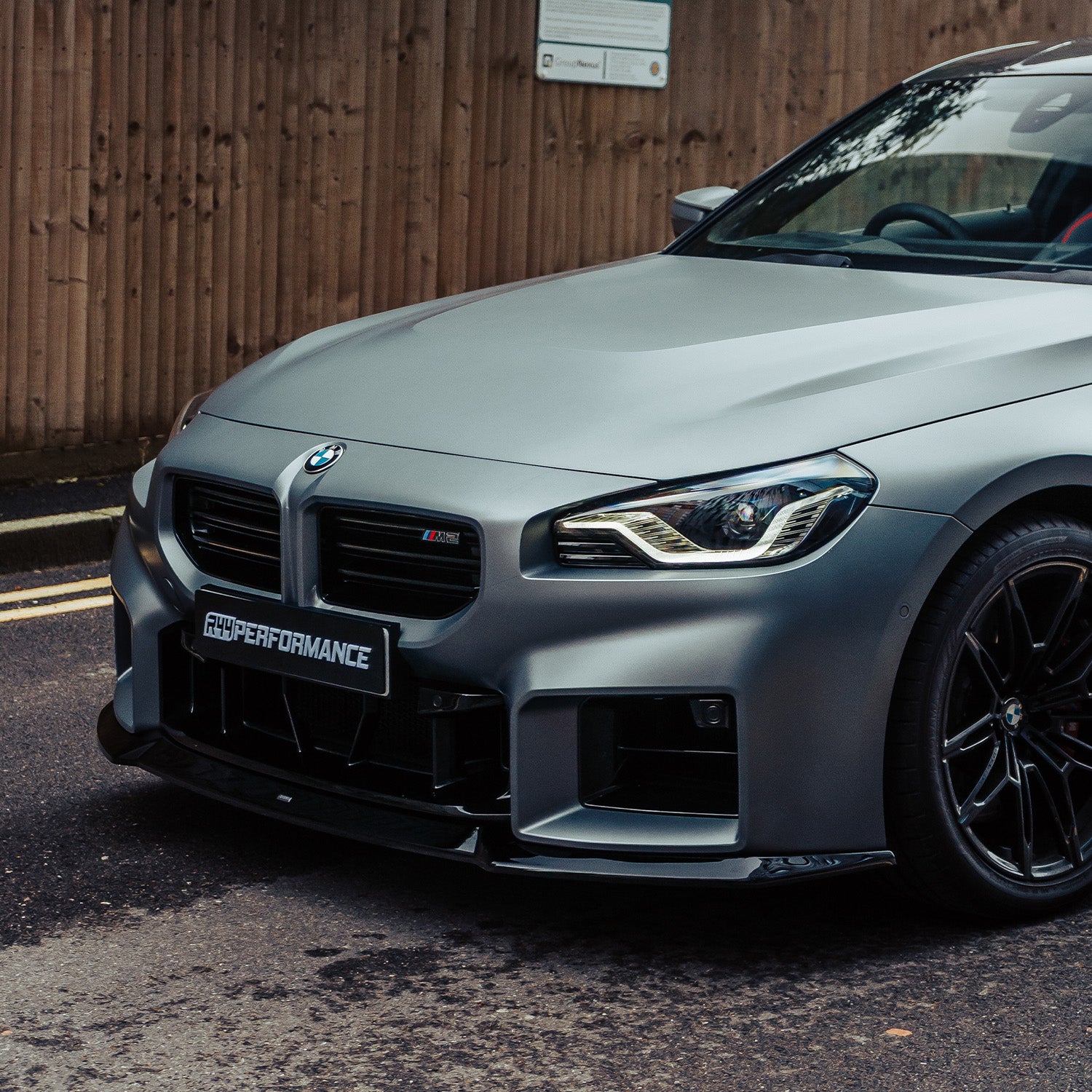 ZAERO Design BMW G87 M2 EVO-S Gloss Black Front Splitter On Grey Car