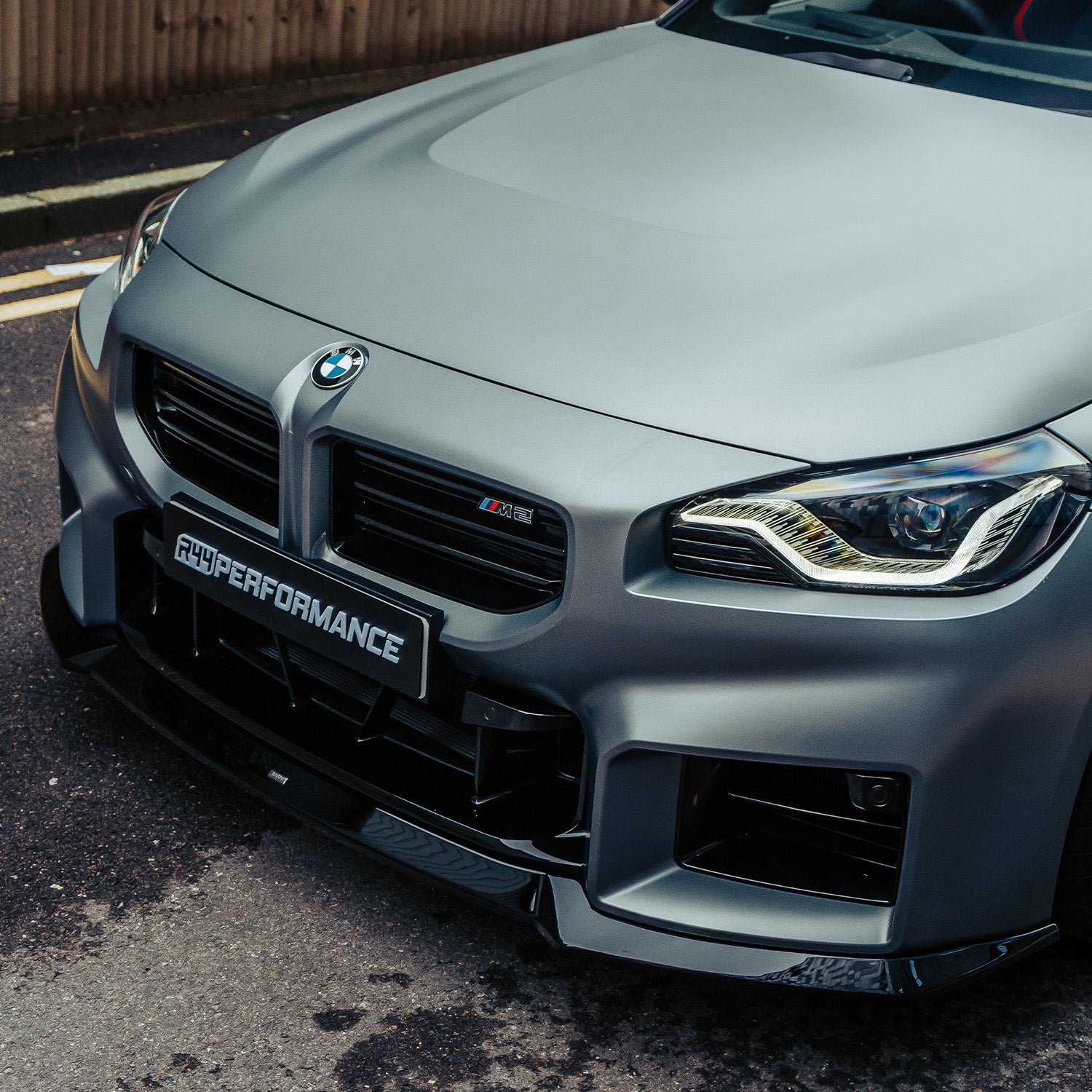 ZAERO Design BMW G87 M2 EVO-S Gloss Black Front Splitter On Grey Car