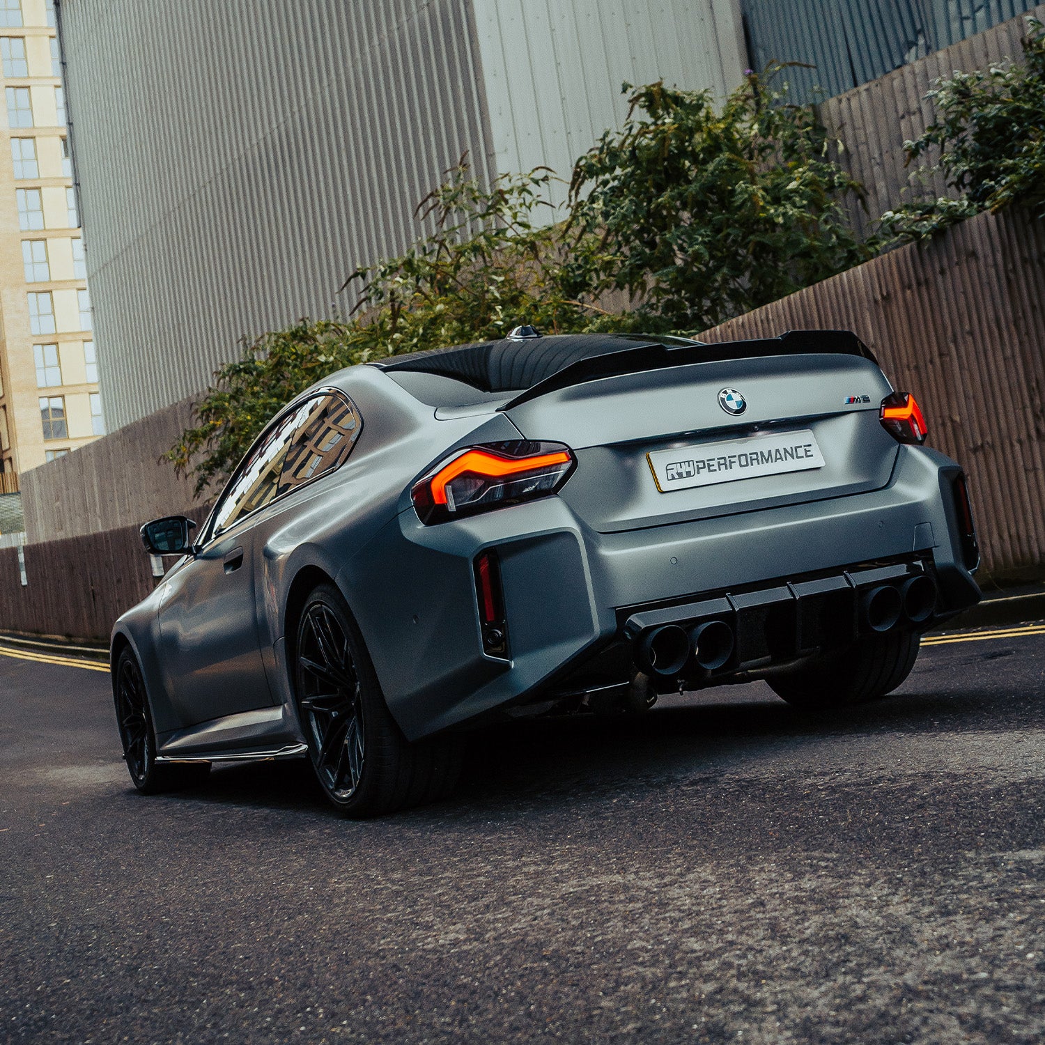 ZAERO Design BMW G87 M2 EVO-S Gloss Black Side Skirts Fitted On Grey Car