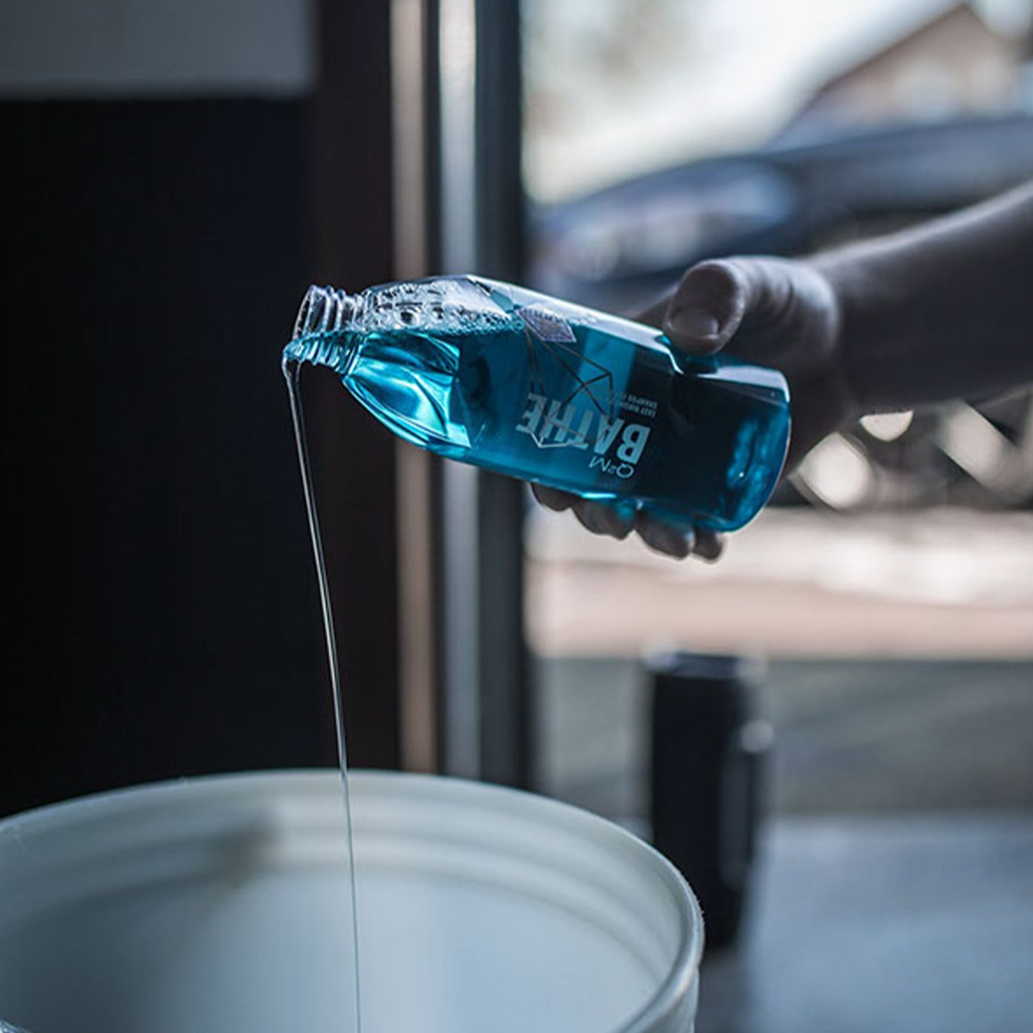 Gyeon Q2M Bathe Shampoo Car Wash Pouring Into Bucket - Available At R44 Detailing