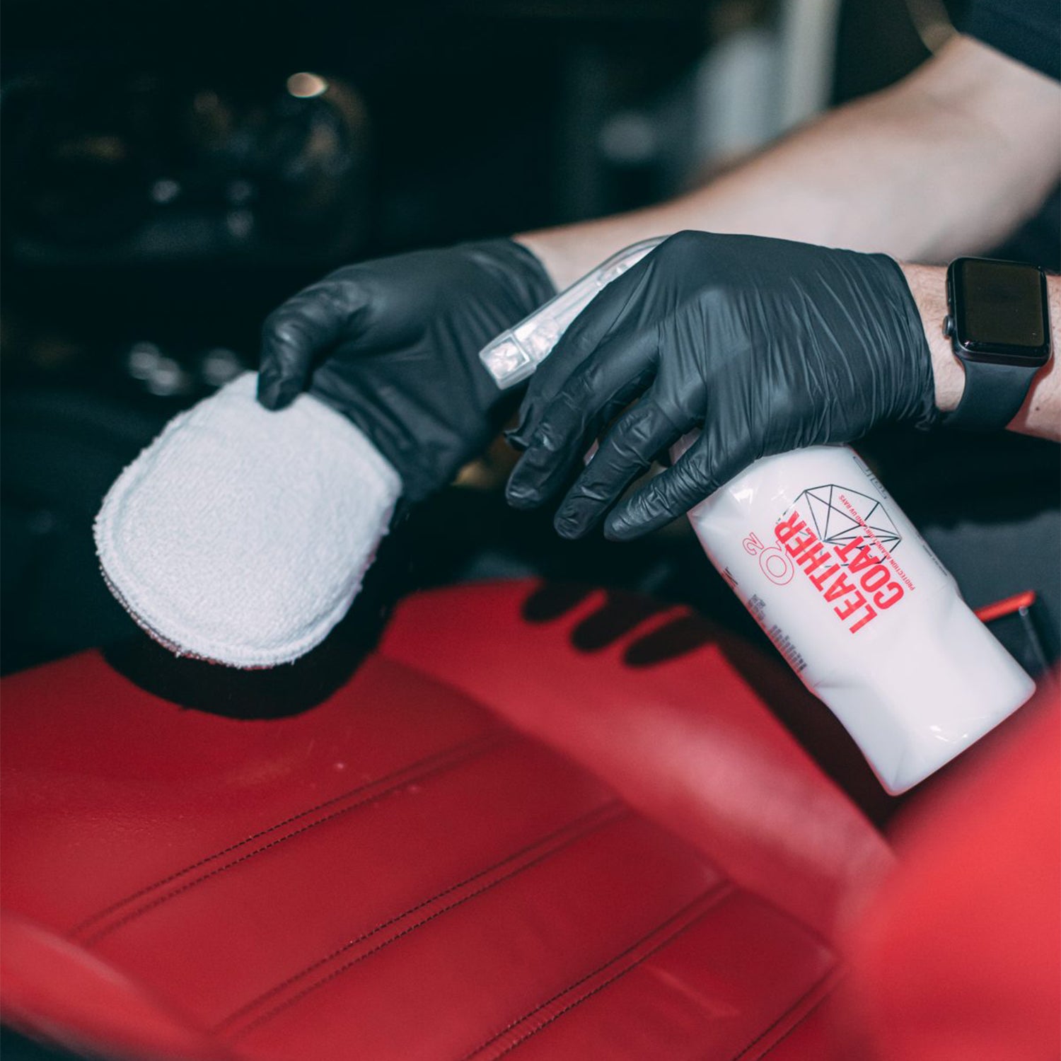 Gyeon Q2 Leather Coat Leather Protection Being Sprayed On To Applicator - Available At R44 Detailing