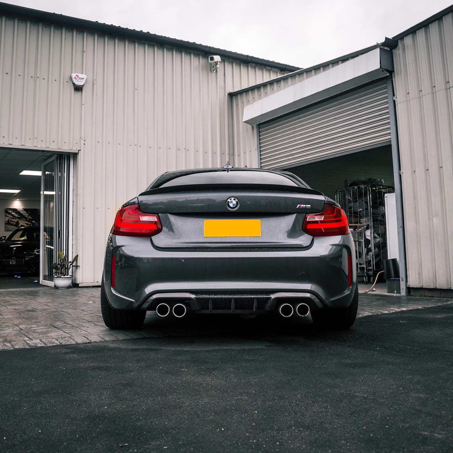MHC+ BMW F87 M2 Gloss Carbon Fibre Performance Rear Diffuser Fitted On Grey Car