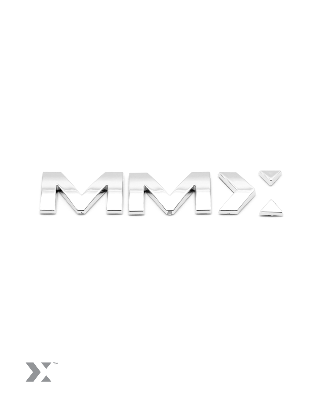MMX 100mm vehicle badge in bright chrome finish with 3M adhesive backing