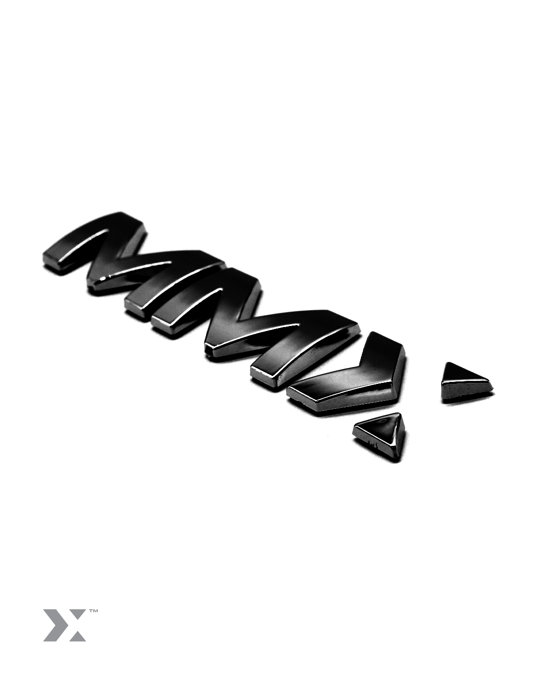 MMX 100mm vehicle badge in bright chrome finish with 3M adhesive backing