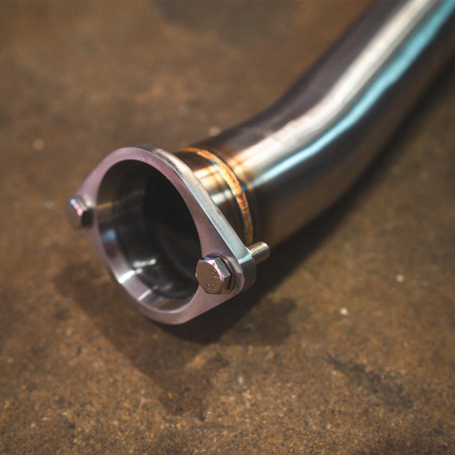 BMW E60 M5 Valvetronic Designs exhaust system on a concrete floor